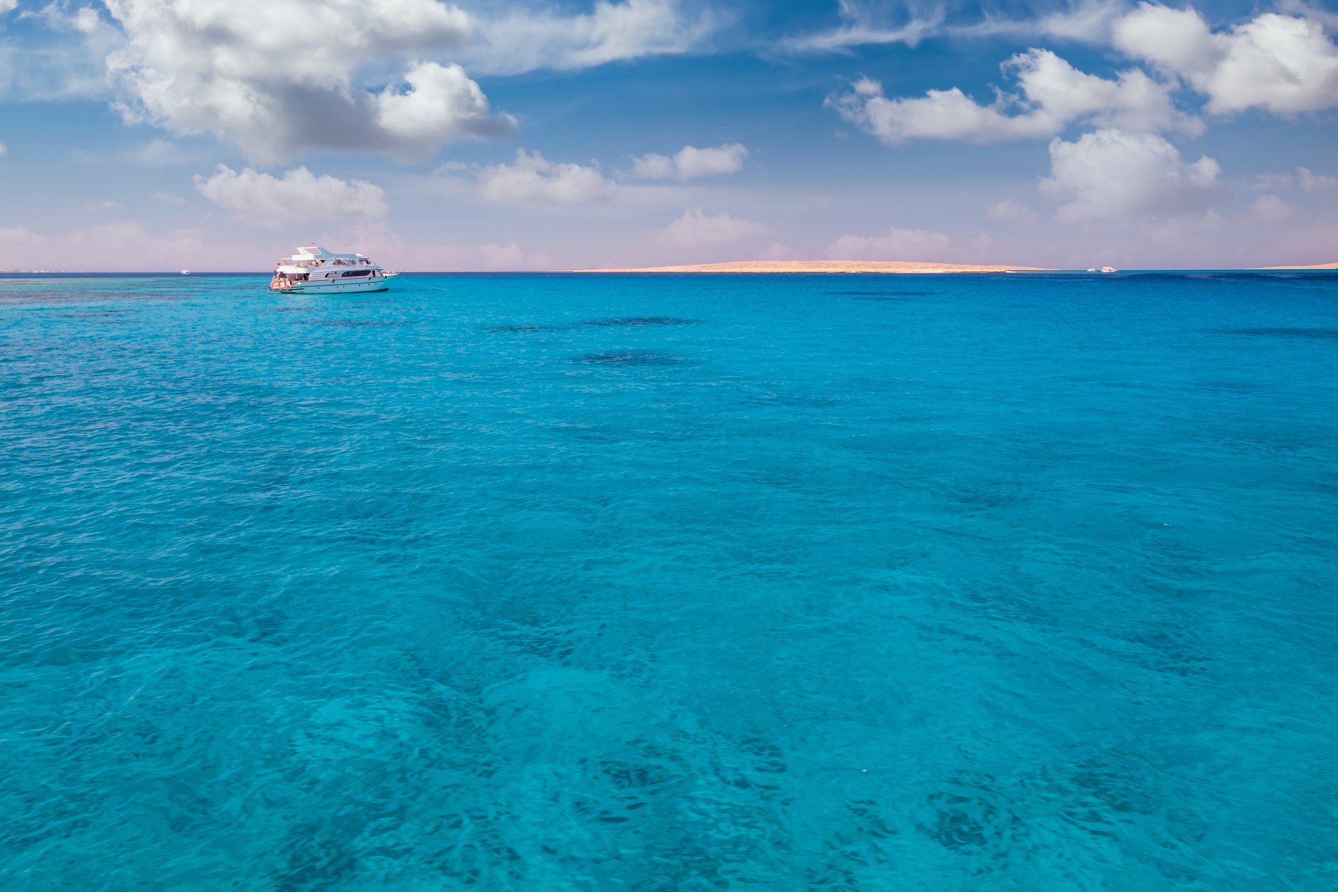 cruise-yacht-bow-in-clear-water-near-a-coral-reef-2021-08-29-07-16-59-utc