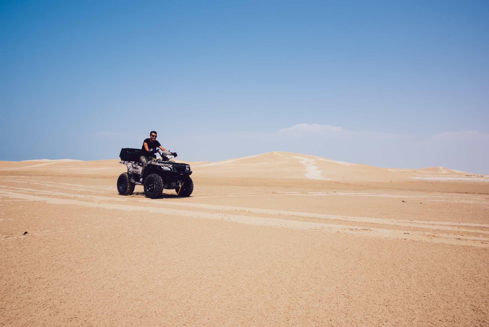 extreme-rider-on-quad-in-sandy-desert-2023-11-27-05-19-59-utc