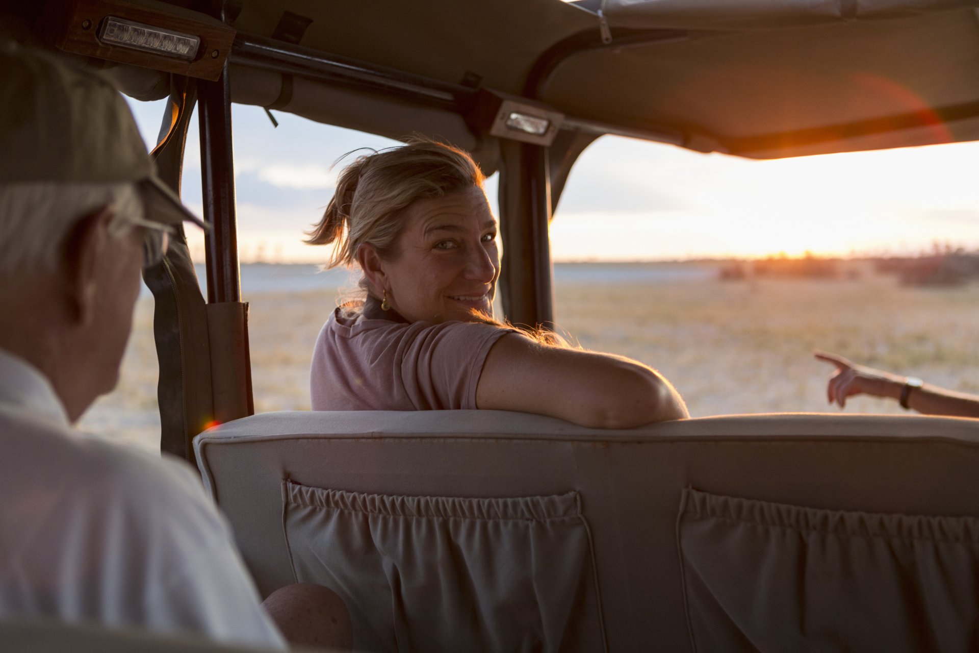 family-in-safari-vehicle-kalahari-desert-makgadi-2023-11-27-05-28-55-utc