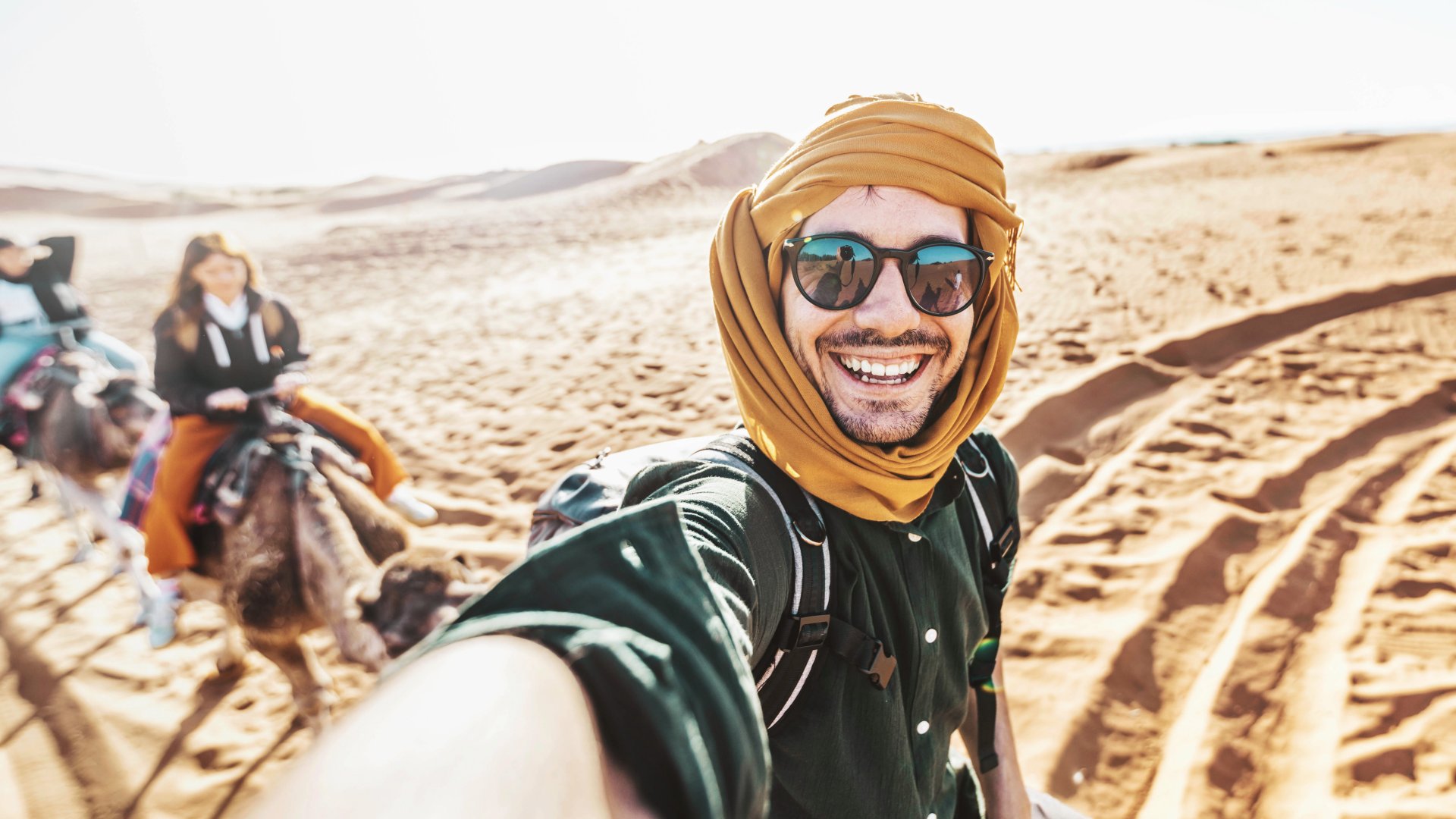 happy-tourist-having-fun-enjoying-group-camel-ride-2023-11-27-05-26-54-utc